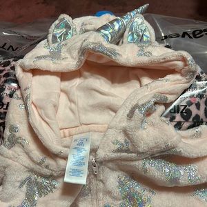 A girls unicorn onesie